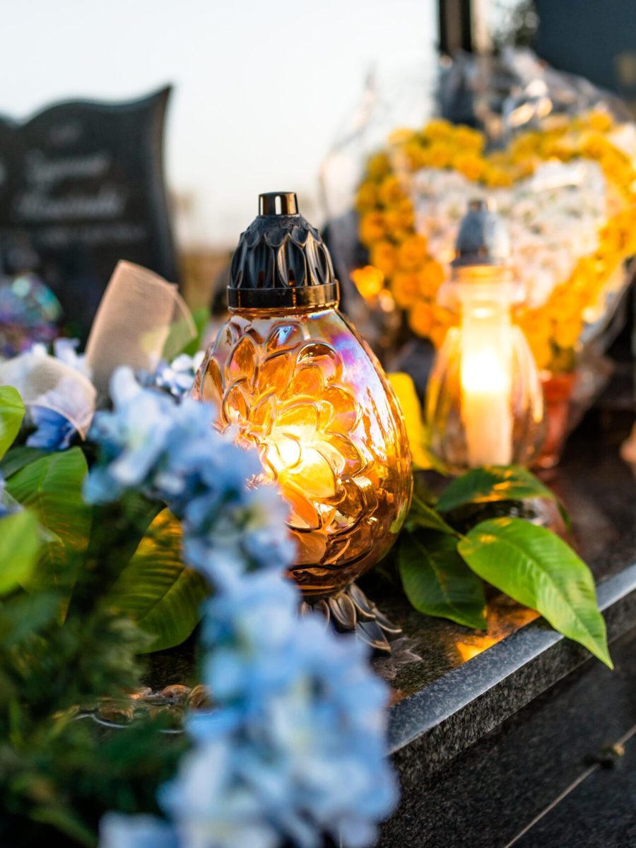 artificial-and-real-flowers-and-lit-candles-lying-2026-01-09-01-01-27-utc